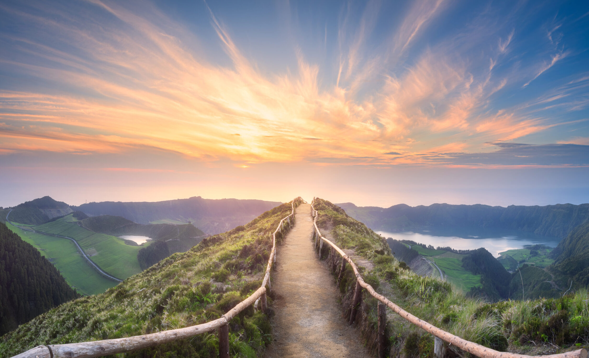 Mountain path with bright clouds